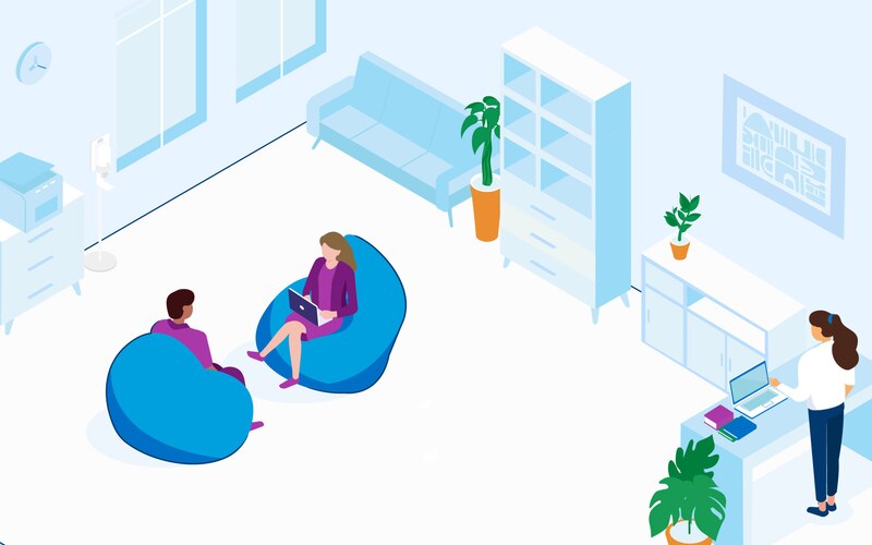 Employees working in an office at standing desks and on bean bags