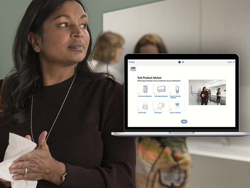 Women in a public restroom washing and drying their hands, in front a laptop showing Tork Product Advisor Tool