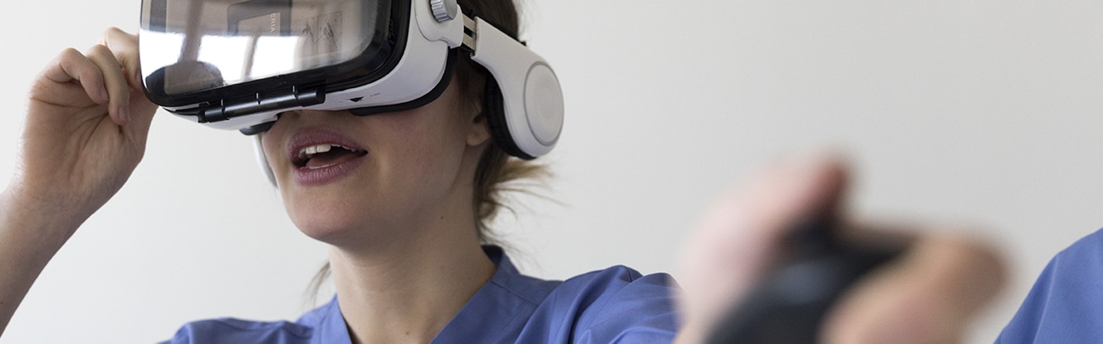 Nurse wearing virtual reality goggles