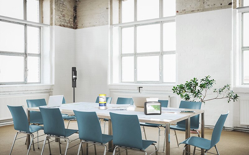 A office meeting room with table and chairs