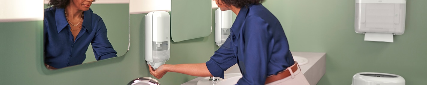 Title text has not been added Person washing their hands at washroom sink