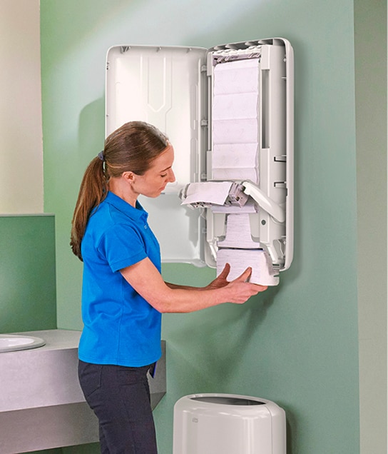 A person walking into an office washroom