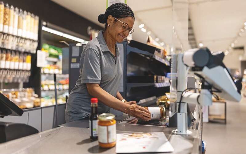 A woman scanning a product