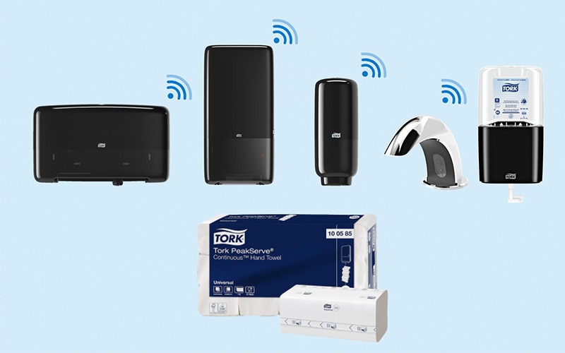 llustration showing IOT connected black dispensers compatible with Tork Vision Cleaning, and a consumer unit with paper hand towels
