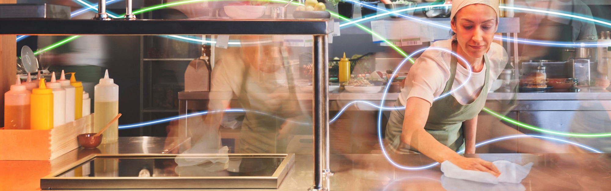 a busy kitchen with a female chef wiping a surface – timelapse a busy kitchen with a female chef wiping a surface – timelapse