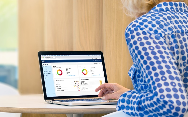 Title text has not been added Image of facility manager reviewing cleaning status on a laptop