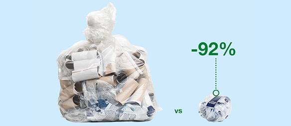 Title text has not been added Plastic bag filled with toilet paper rolls. A label on the bin indicates that 92% of these items can be recycled.